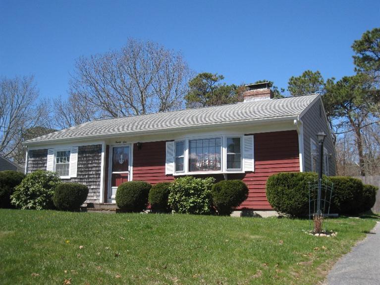 21 Megan Road Hyannis, MA 02601 - Photo 2 of 9 a view of a house with a garden