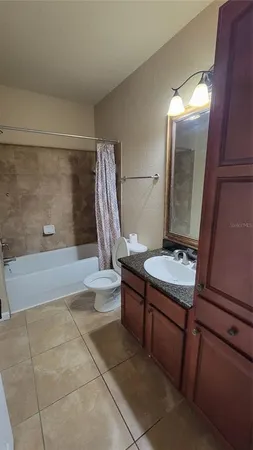 a bathroom with a sink a toilet and tub