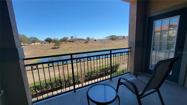 a view of a balcony with furniture