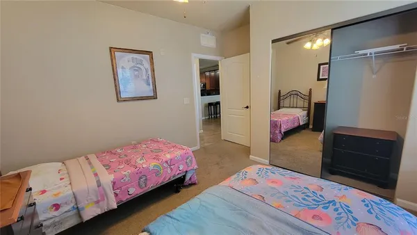 a bedroom with a bed and a dresser