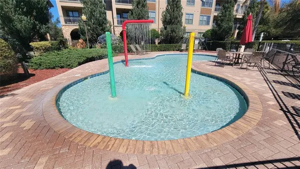 a view of a house with swimming pool and a porch