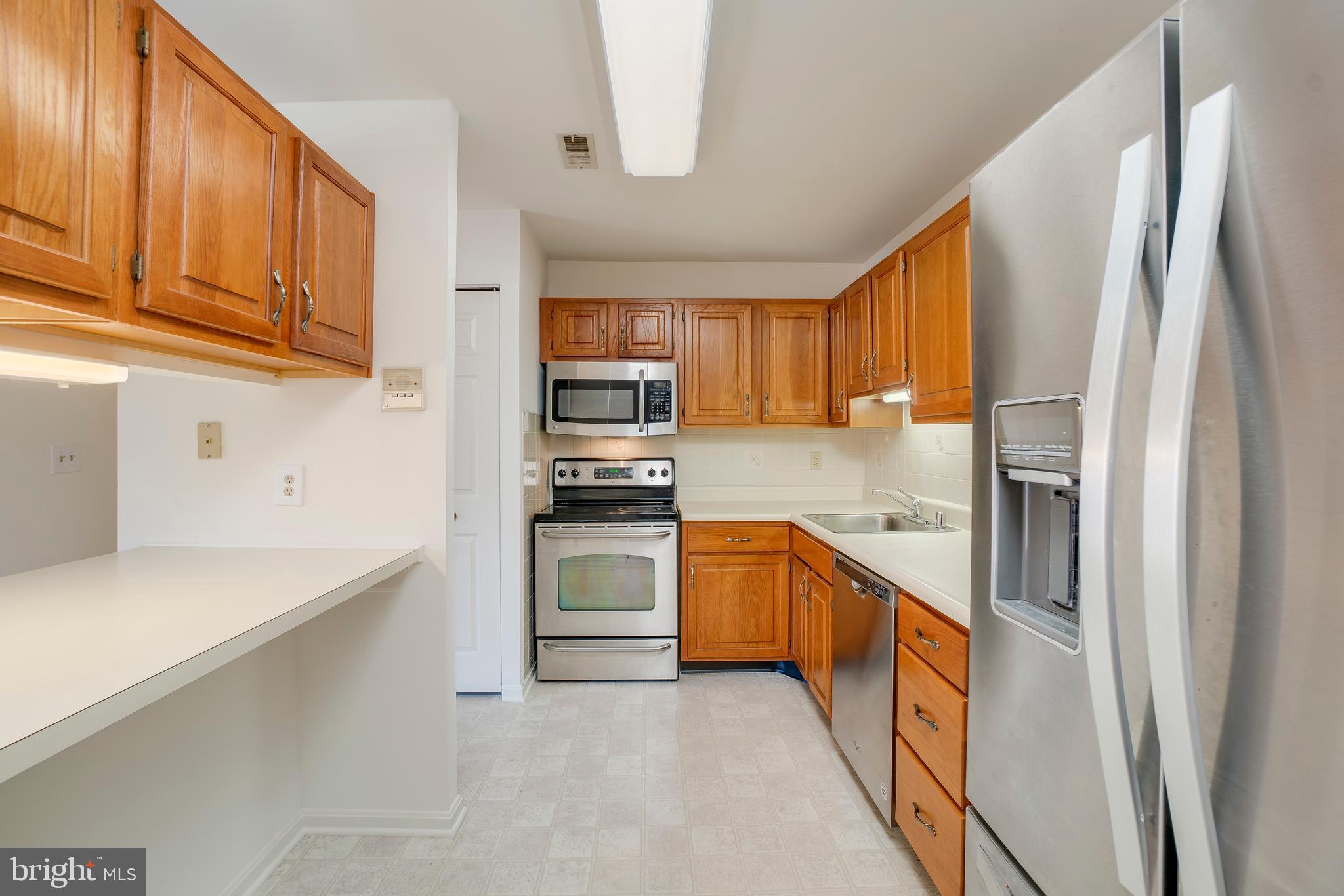 4104 Chardel Road, Unit 1B Baltimore, MD 21236 - Photo 4 of 20 Kitchen With Breakfast Bar / Pass Through