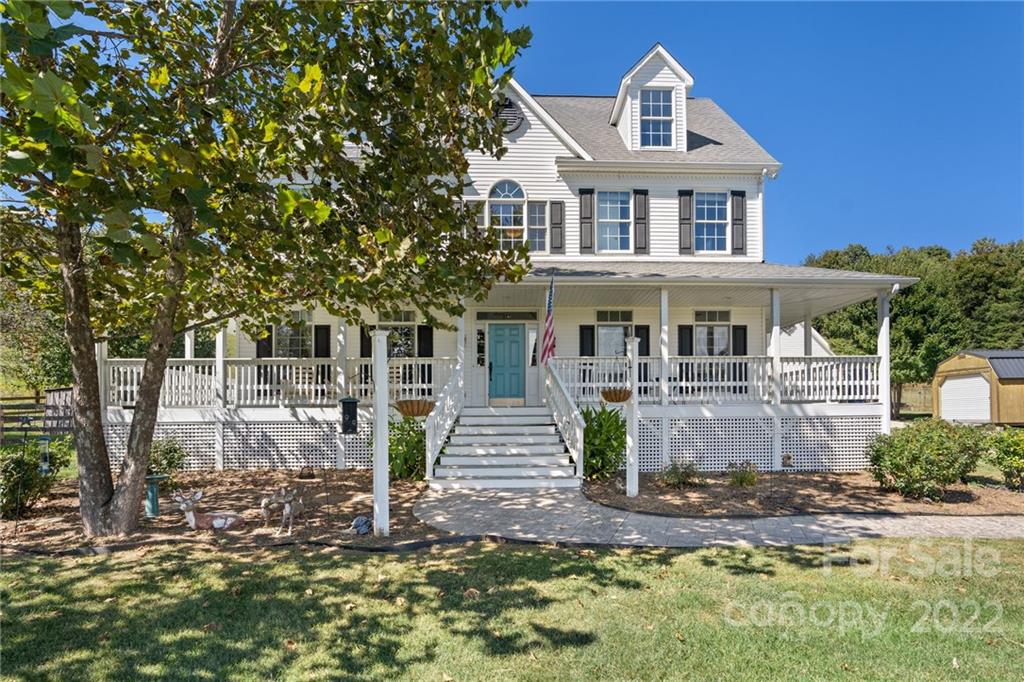 770 Grindstone Road Waynesville, NC 28785 - Photo 1 of 48 a front view of a house with a yard