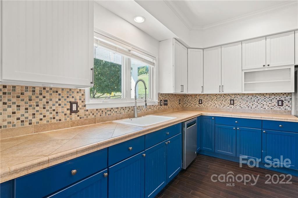 770 Grindstone Road Waynesville, NC 28785 - Photo 12 of 48 a kitchen with sink and cabinets