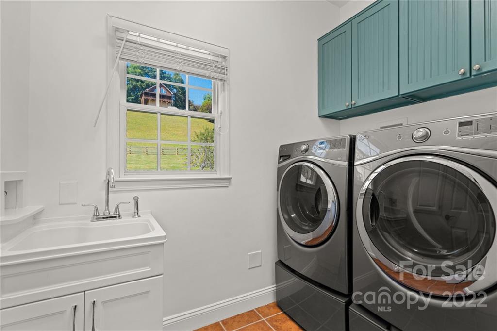 770 Grindstone Road Waynesville, NC 28785 - Photo 19 of 48 a utility room with sink dryer and washer