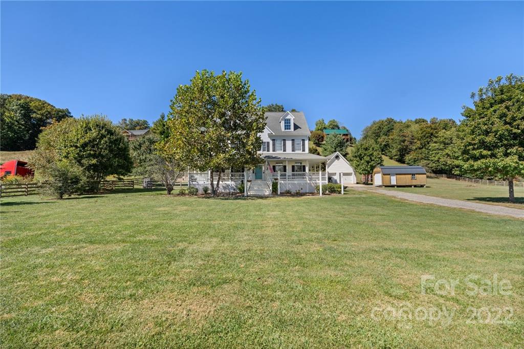 770 Grindstone Road Waynesville, NC 28785 - Photo 2 of 48 a view of a street with houses
