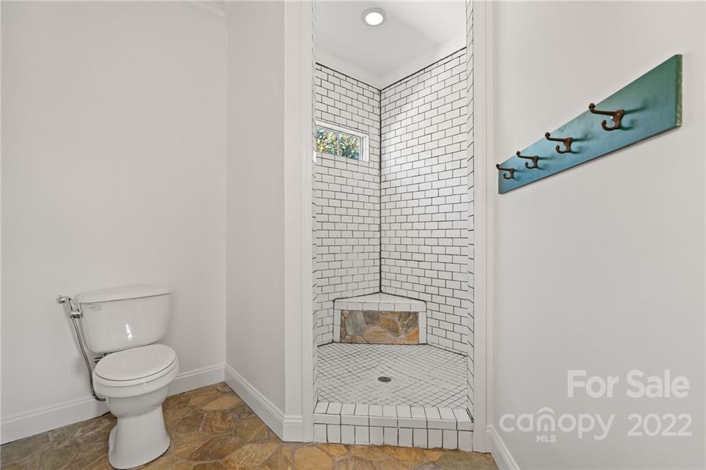 770 Grindstone Road Waynesville, NC 28785 - Photo 24 of 48 a bathroom with a toilet and a shower
