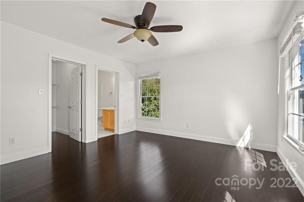 770 Grindstone Road Waynesville, NC 28785 - Photo 30 of 48 a view of an empty room with wooden floor and a window