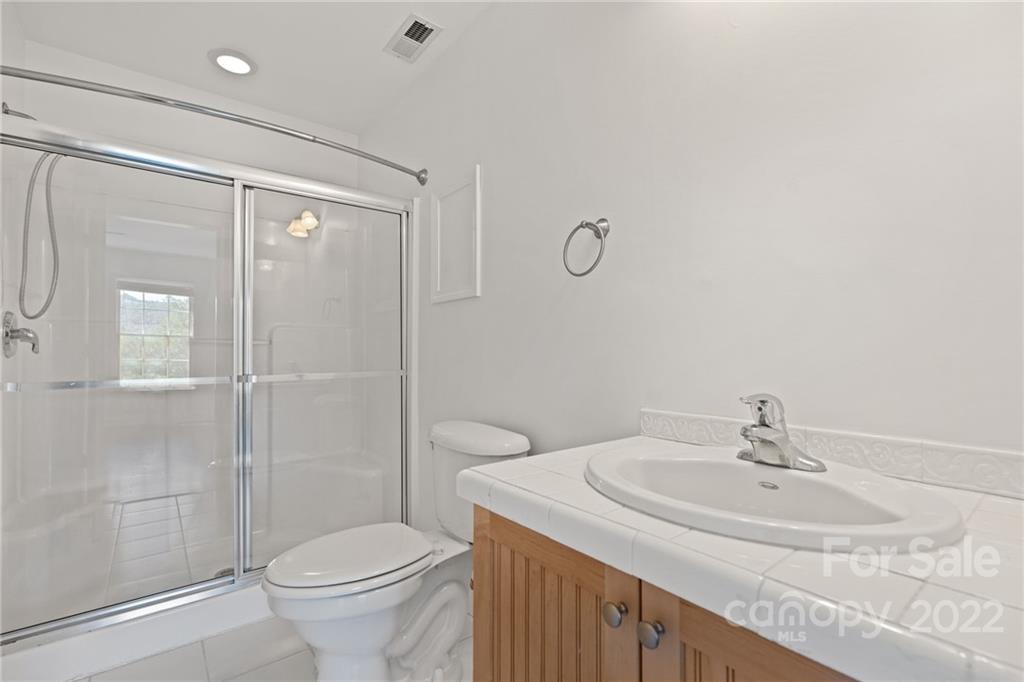 770 Grindstone Road Waynesville, NC 28785 - Photo 34 of 48 a bathroom with a sink toilet and shower