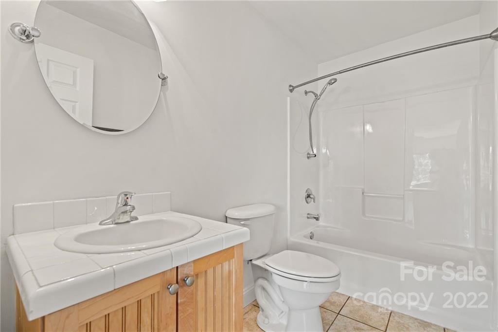 770 Grindstone Road Waynesville, NC 28785 - Photo 35 of 48 a bathroom with a sink toilet and shower