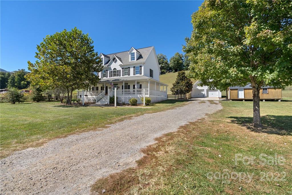 770 Grindstone Road Waynesville, NC 28785 - Photo 4 of 48 a view of house with yard in front of it