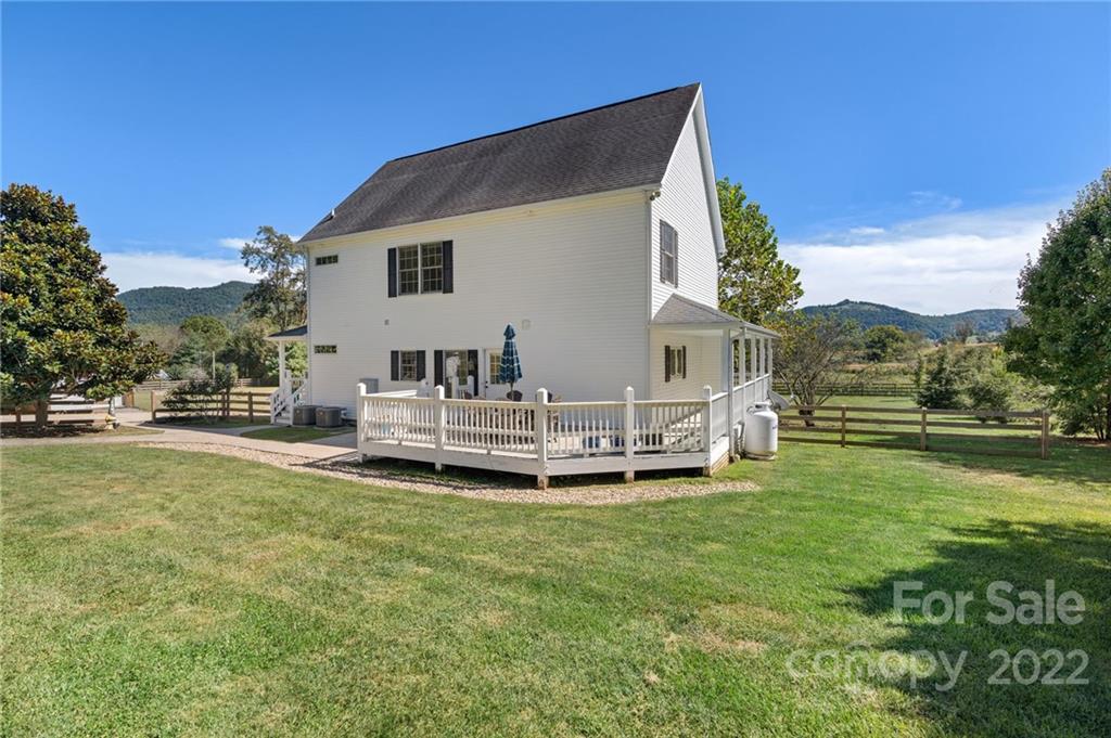 770 Grindstone Road Waynesville, NC 28785 - Photo 44 of 48 a view of a house with a yard porch and sitting area