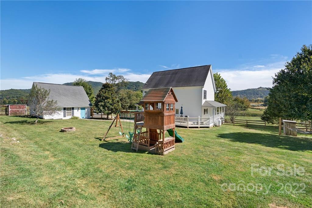 770 Grindstone Road Waynesville, NC 28785 - Photo 46 of 48 a view of a house with a backyard