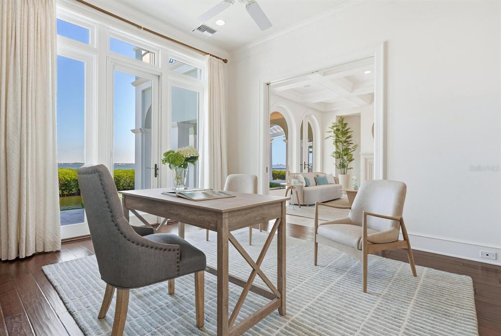 560 Harbor Point Road Longboat Key, FL 34228 - Photo 19 of 64 a view of a dining room with furniture window and wooden floor