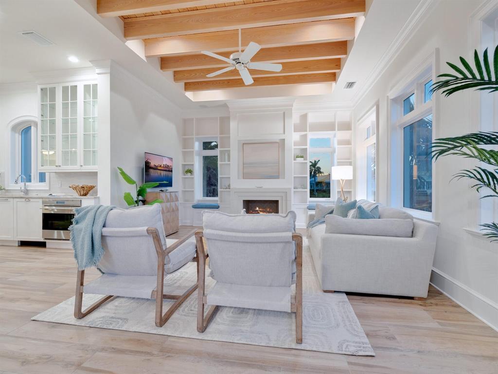 560 Harbor Point Road Longboat Key, FL 34228 - Photo 59 of 64 a living room with furniture and a fireplace