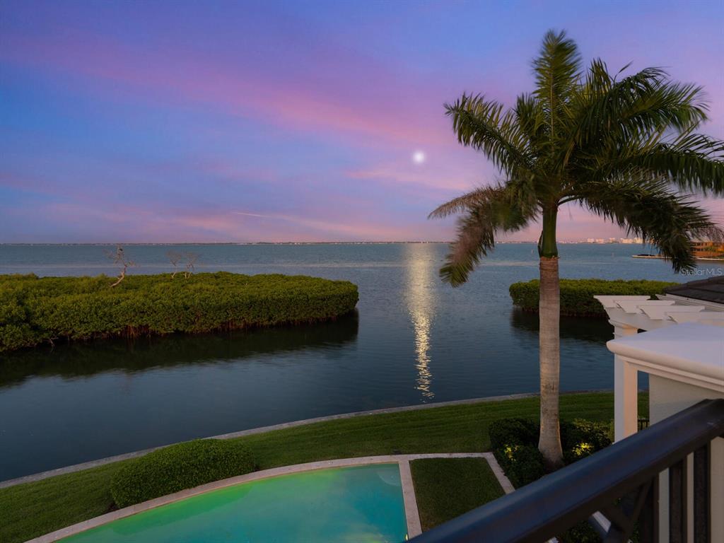 560 Harbor Point Road Longboat Key, FL 34228 - Photo 63 of 64 a view of swimming pool from a lake