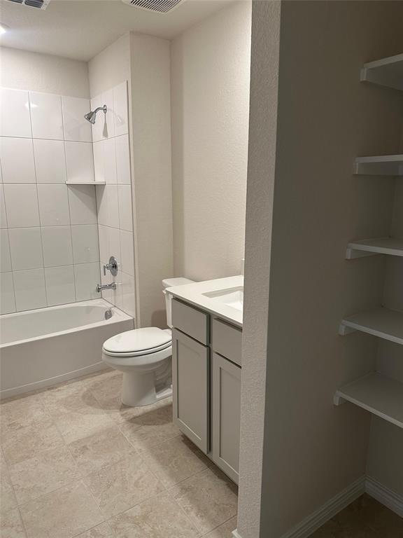 2408 Grapevine Way Celina, TX 75009 - Photo 13 of 20 Bathroom featuring vanity, shower / tub combination, and a textured wall