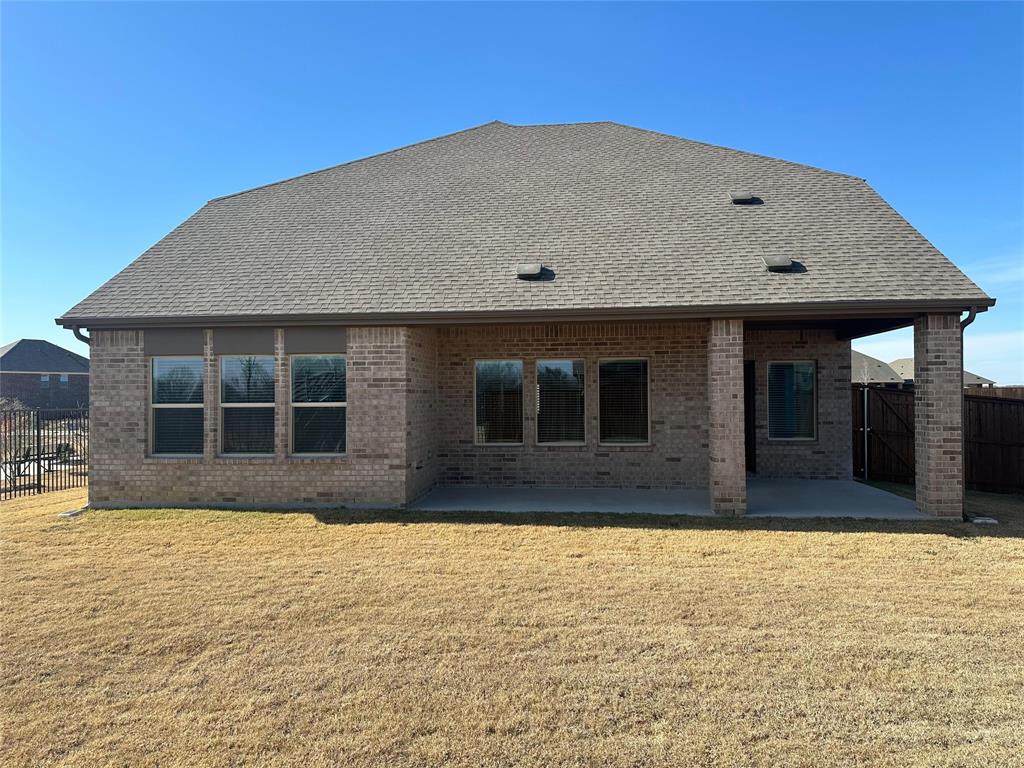 2408 Grapevine Way Celina, TX 75009 - Photo 17 of 20 Rear view of property featuring a fenced backyard, a patio area, brick siding, and a gate