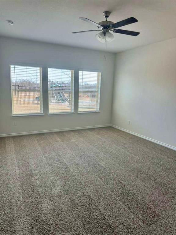 2408 Grapevine Way Celina, TX 75009 - Photo 7 of 20 Empty room with ceiling fan and carpet floors