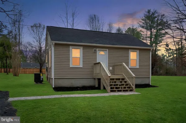 a backyard of a house with lots of green space