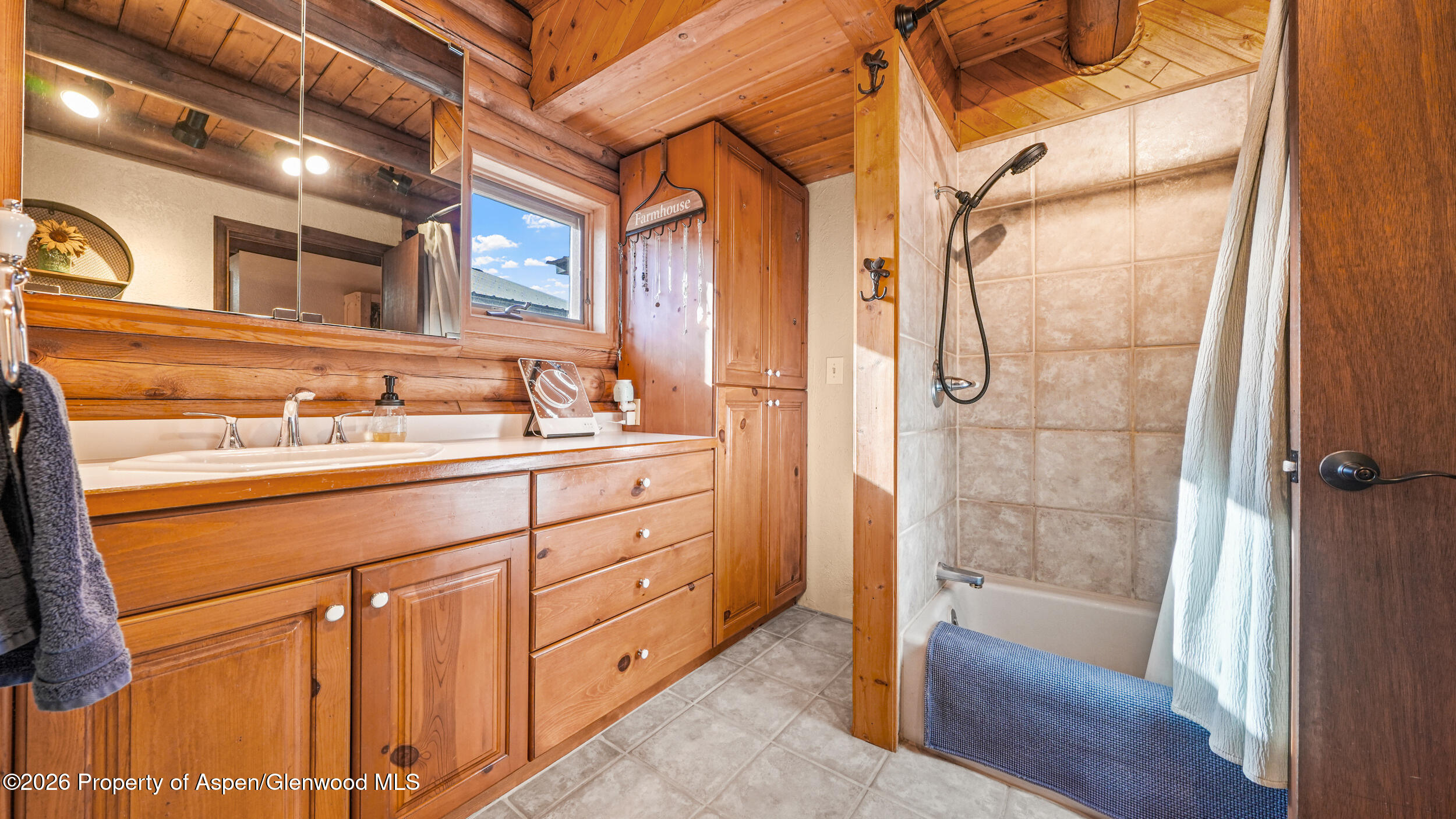 1355 N Road Loma, CO 81524 - Photo 28 of 51 a bathroom with a double vanity sink a toilet and shower