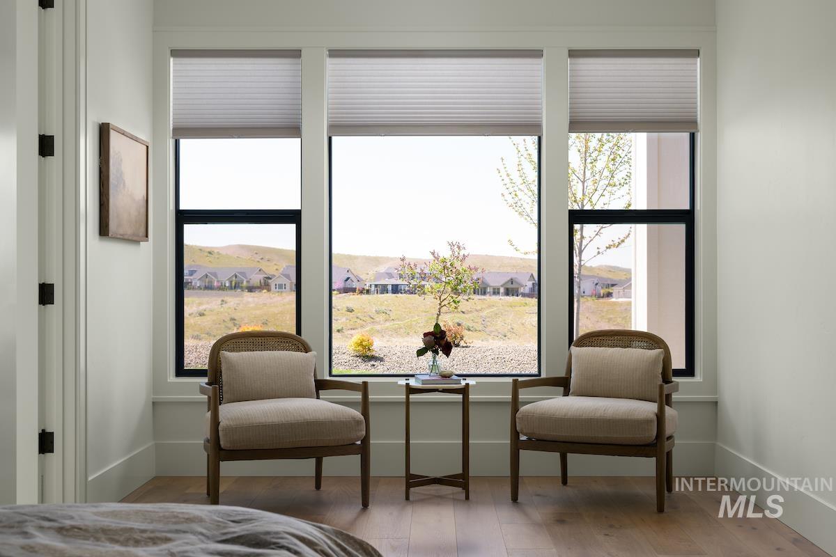 11415 North Misty Ridge Way Boise, ID 83714 - Photo 11 of 46 Bedroom featuring wood finished floors and multiple windows