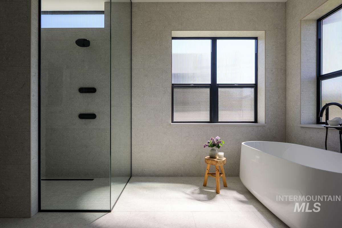 11415 North Misty Ridge Way Boise, ID 83714 - Photo 16 of 46 Bathroom with a walk in shower and a soaking tub