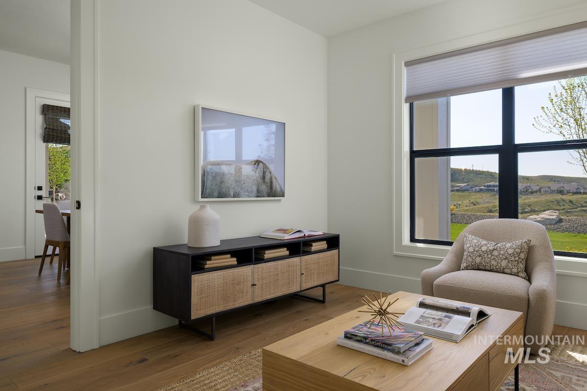 11415 North Misty Ridge Way Boise, ID 83714 - Photo 23 of 46 Living area with healthy amount of natural light and wood finished floors