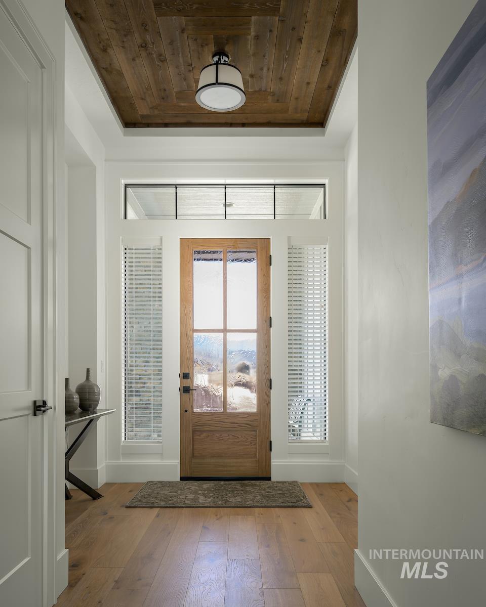 11415 North Misty Ridge Way Boise, ID 83714 - Photo 4 of 46 Entrance foyer with baseboards and wood-type flooring