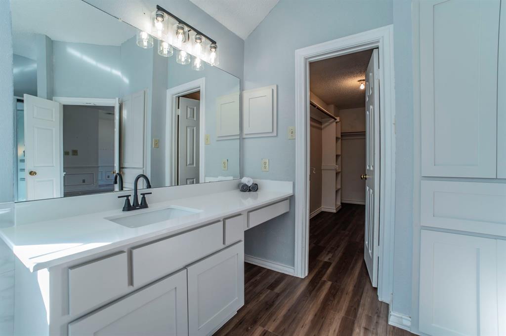 1240 Trinity Drive Benbrook, TX 76126 - Photo 14 of 33 a bathroom with a sink and a mirror