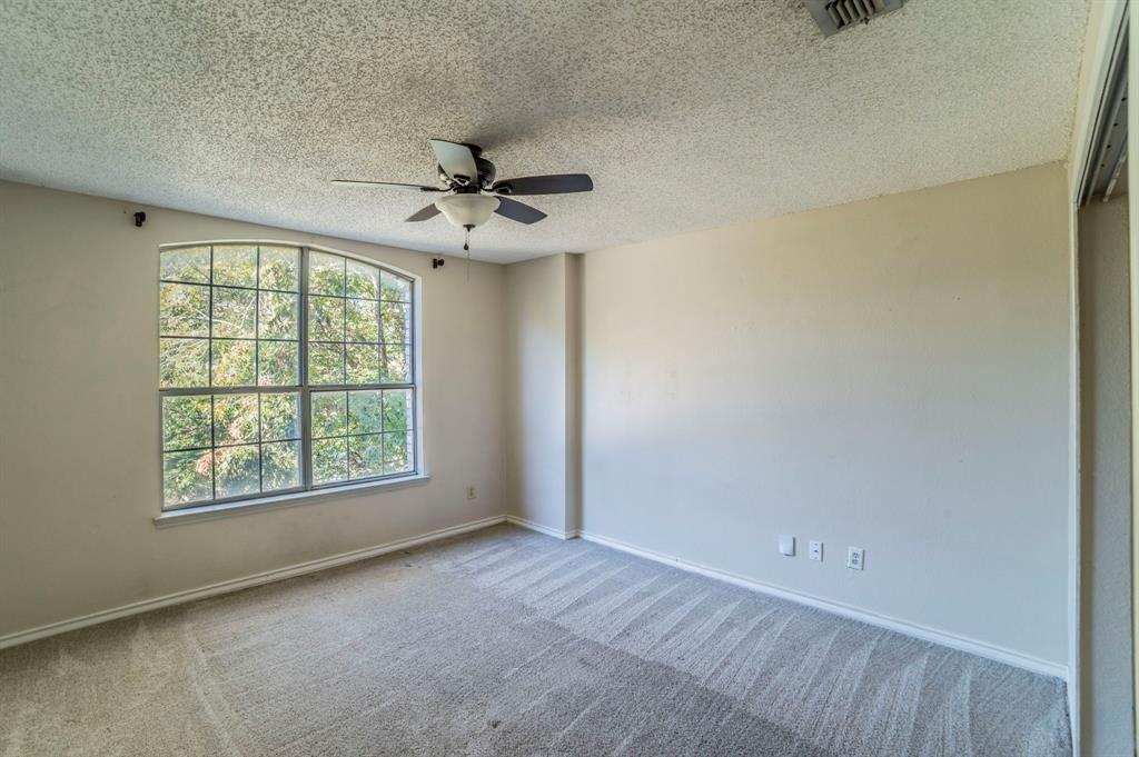 1240 Trinity Drive Benbrook, TX 76126 - Photo 16 of 33 an empty room with windows and fan