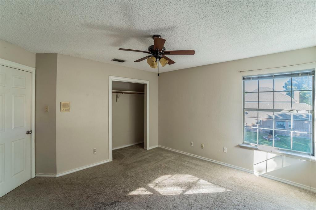 1240 Trinity Drive Benbrook, TX 76126 - Photo 20 of 33 a view of a livingroom with a chandelier fan and windows
