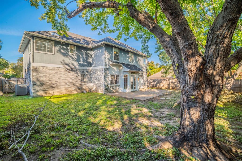 1240 Trinity Drive Benbrook, TX 76126 - Photo 25 of 33 a view of a house with a yard