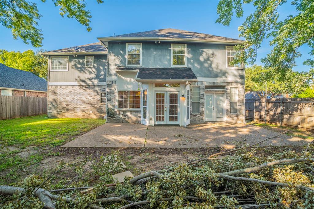 1240 Trinity Drive Benbrook, TX 76126 - Photo 26 of 33 a front view of a house with garden