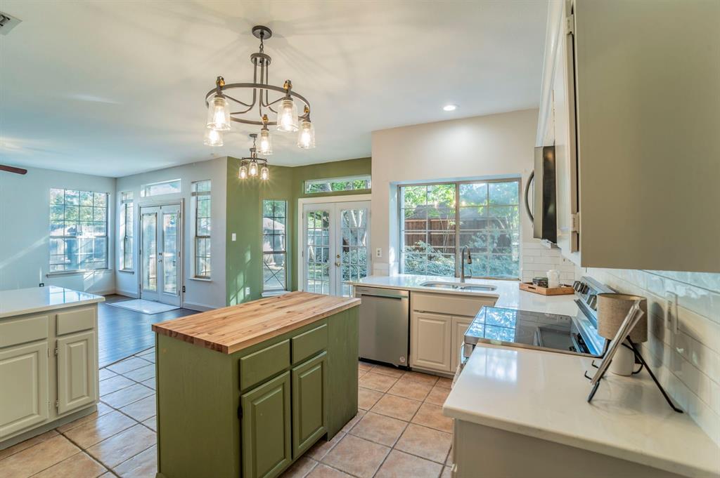 1240 Trinity Drive Benbrook, TX 76126 - Photo 5 of 33 a room with a large window and dining table