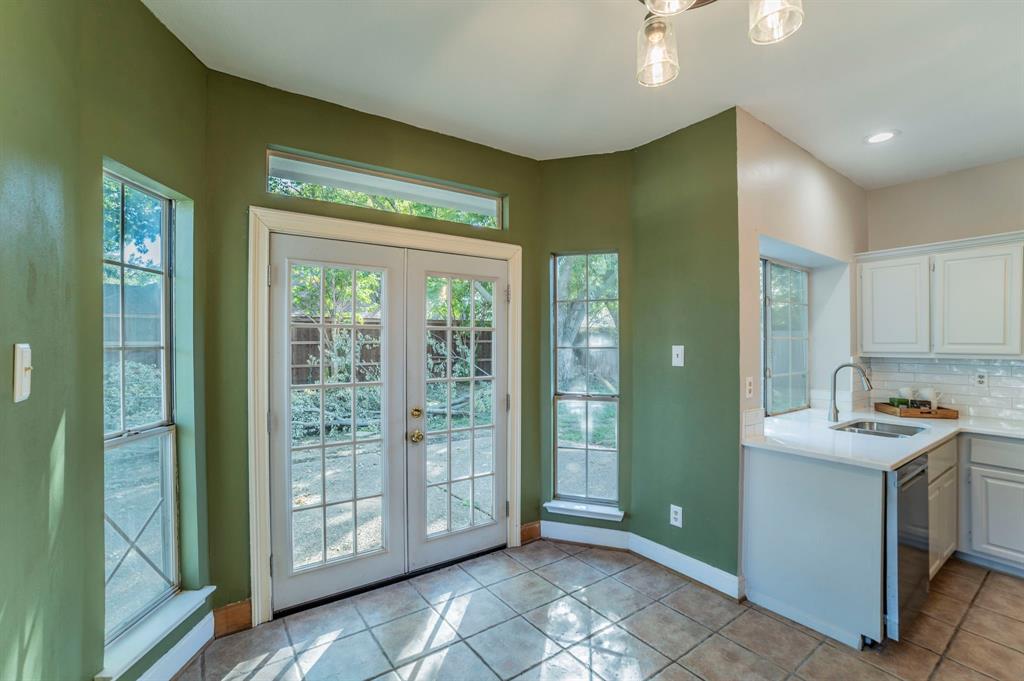 1240 Trinity Drive Benbrook, TX 76126 - Photo 7 of 33 a view of a kitchen with fridge and sink