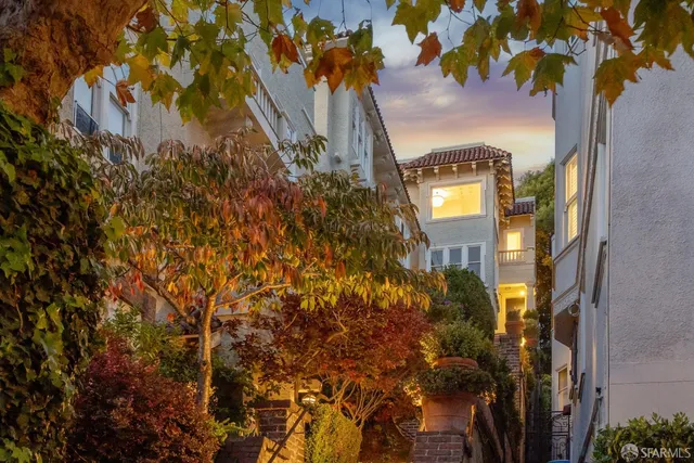a view of a room with table and chair wooden floor