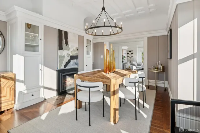 a kitchen with a sink cabinets stainless steel appliances and a window