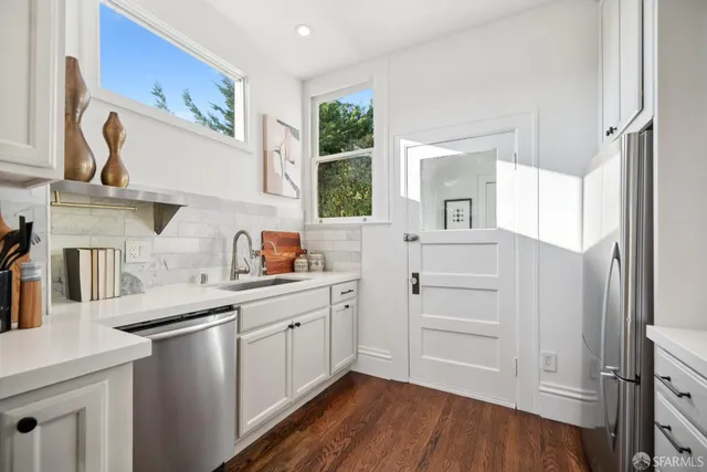 a bathroom with a tub sink and mirror