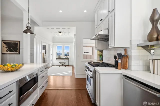 a bath tub sitting next to a white sink