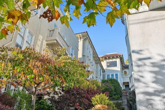 a view of a room with a table and chairs