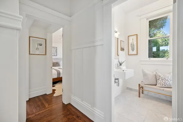 a front view of a building with parking area