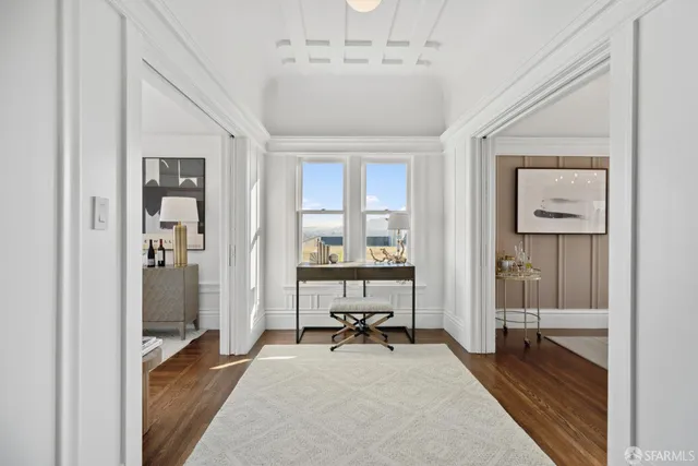 a living room with furniture and a table