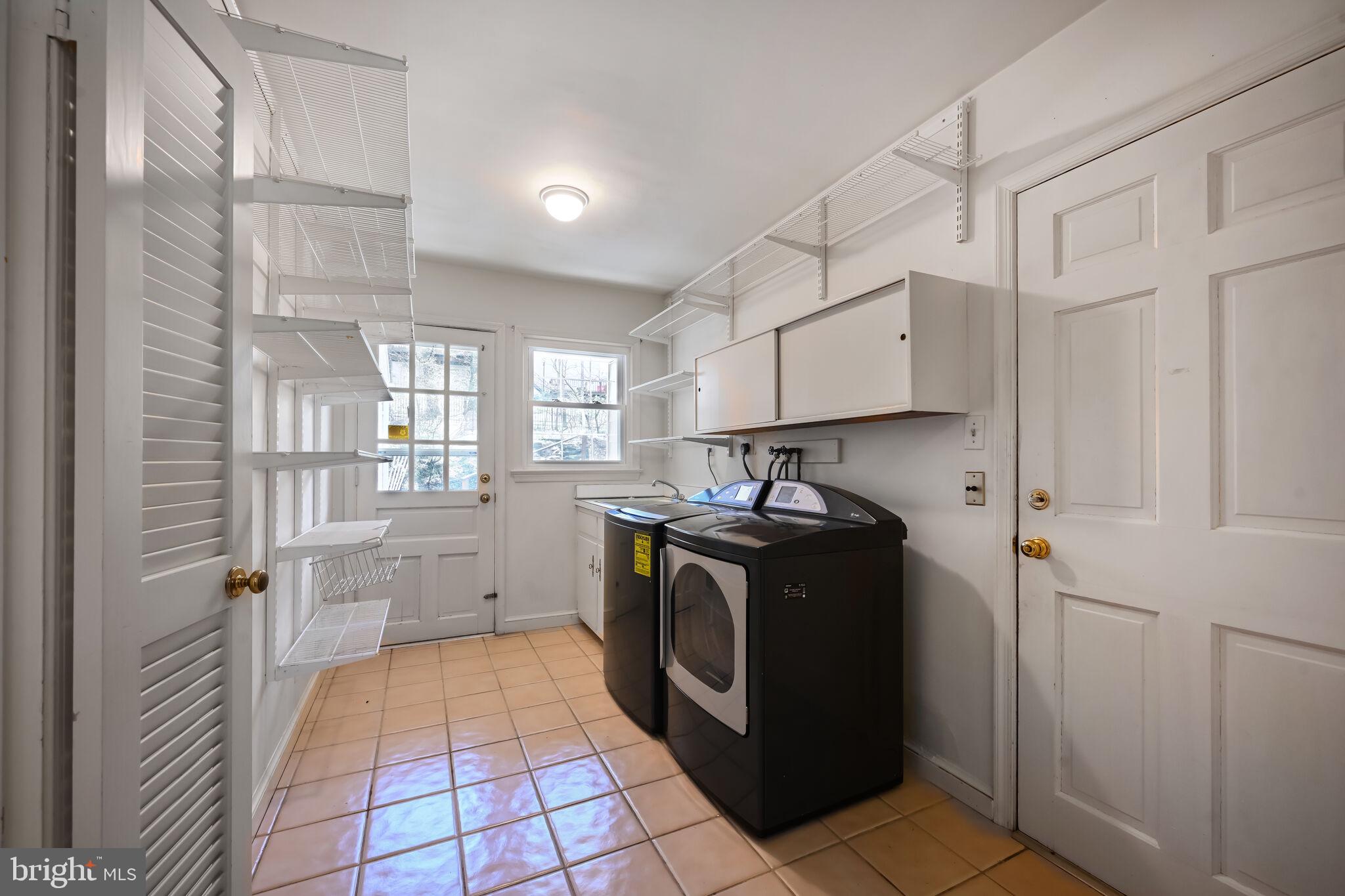 11337 Willowbrook Drive Rockville, MD 20854 - Photo 16 of 50 a kitchen with a refrigerator and a stove