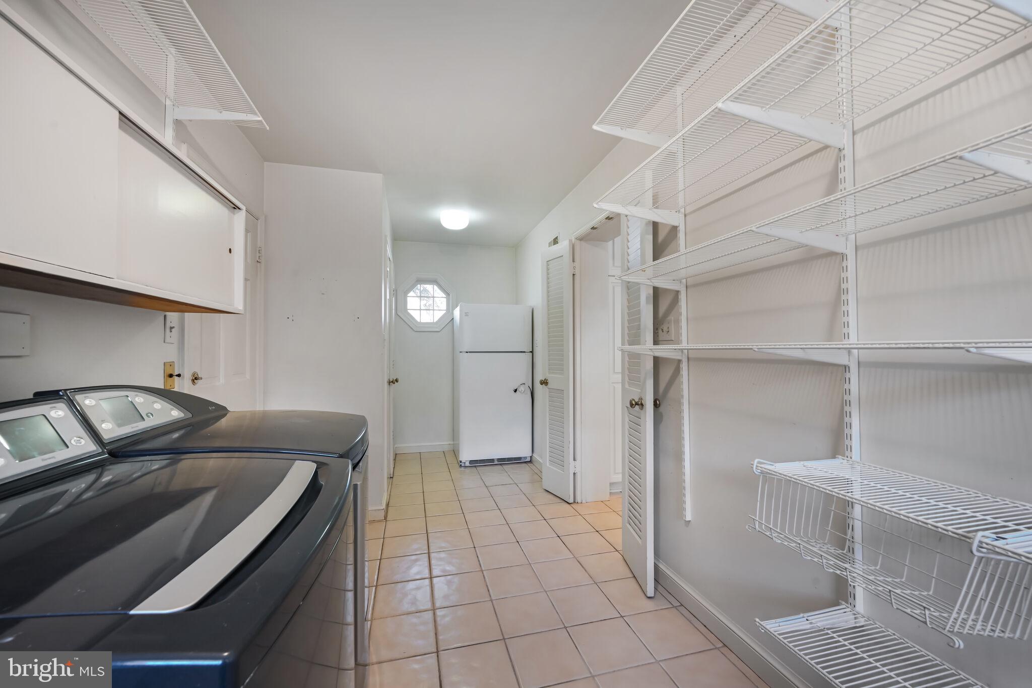 11337 Willowbrook Drive Rockville, MD 20854 - Photo 17 of 50 a kitchen with a sink and refrigerator