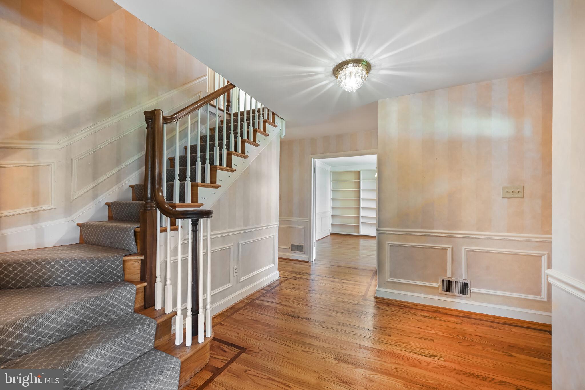 11337 Willowbrook Drive Rockville, MD 20854 - Photo 21 of 50 a view of entryway and hall with wooden floor