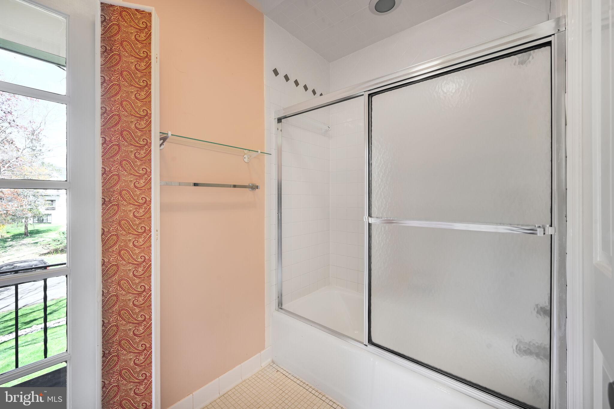 11337 Willowbrook Drive Rockville, MD 20854 - Photo 26 of 50 a bathroom with a glass shower door