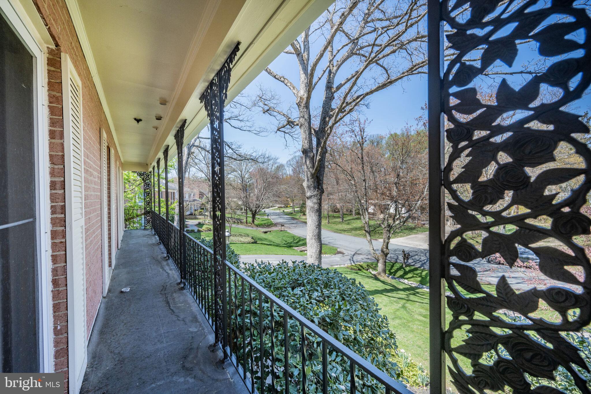 11337 Willowbrook Drive Rockville, MD 20854 - Photo 28 of 50 a view of a pathway of a house with a tree in the background