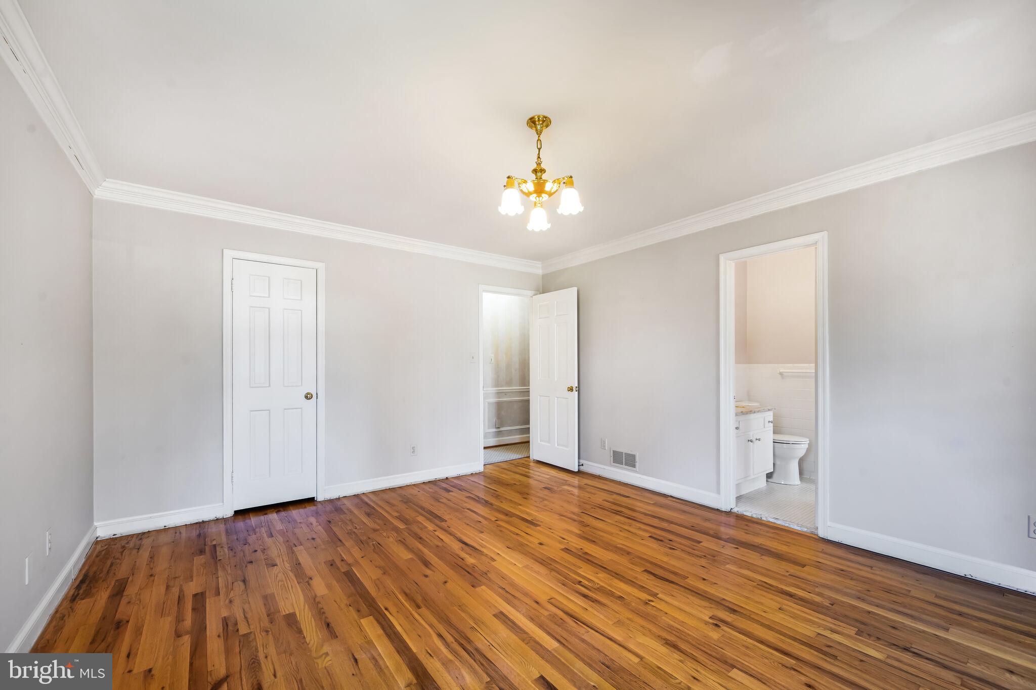11337 Willowbrook Drive Rockville, MD 20854 - Photo 29 of 50 a view of an empty room with wooden floor