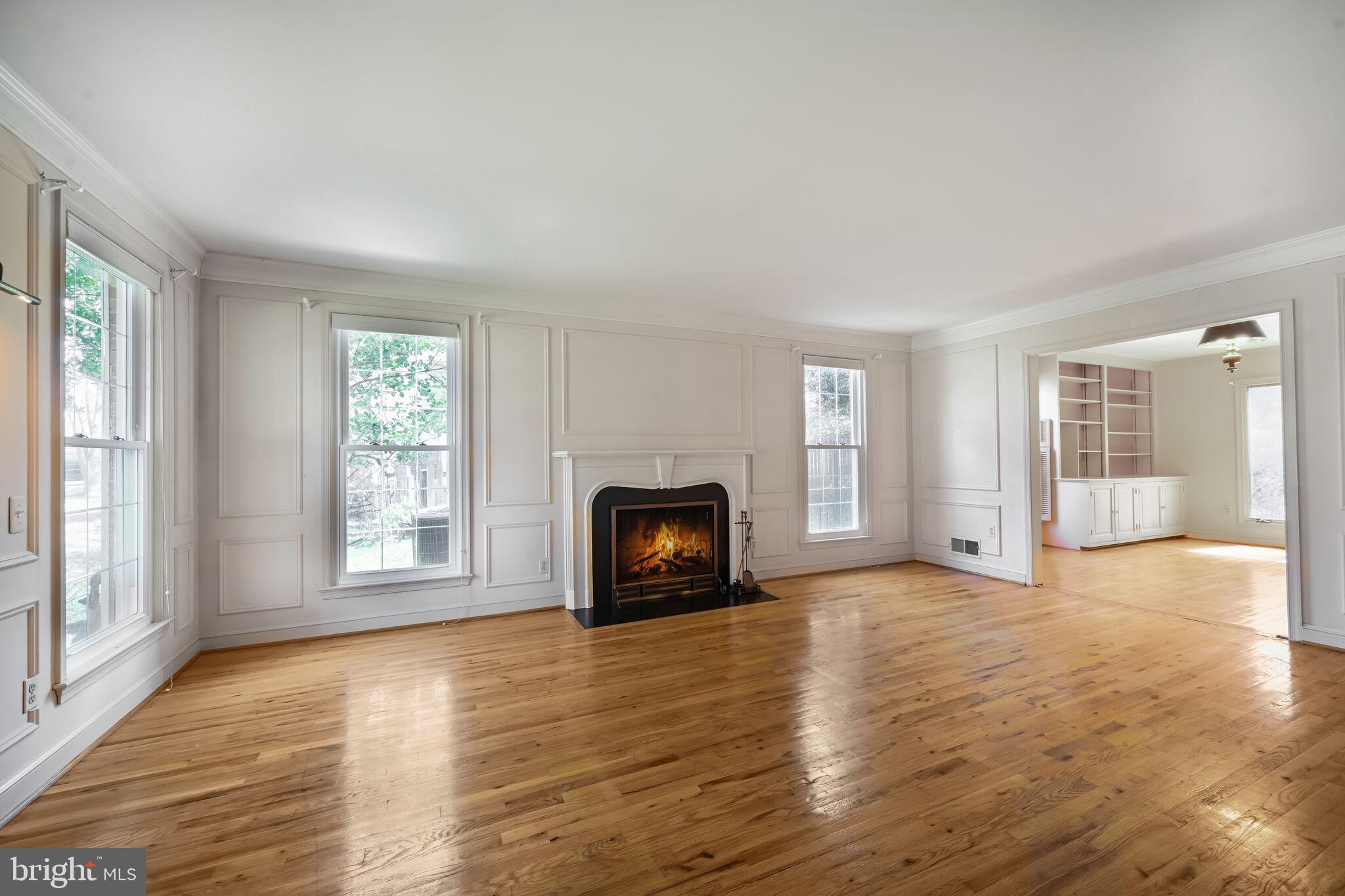 11337 Willowbrook Drive Rockville, MD 20854 - Photo 3 of 50 a view of an empty room with a window and wooden floor